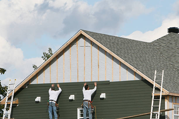Professional Siding Contractor technician working in Andover, MA